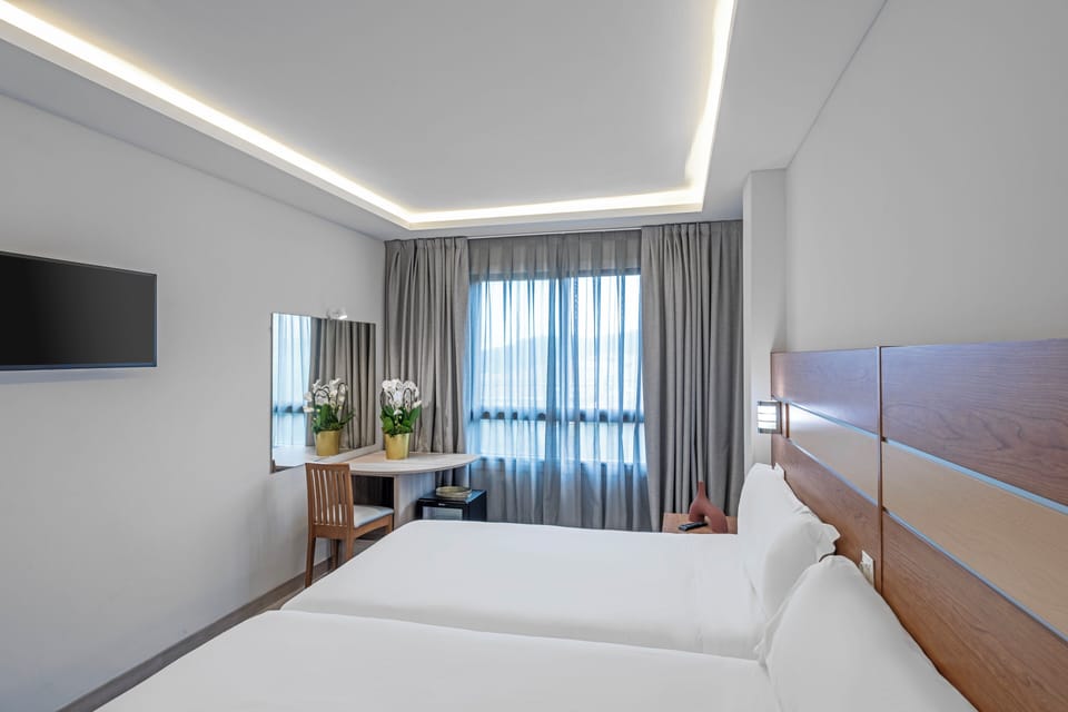 2 Single Beds | Minibar, in-room safe, desk, free WiFi