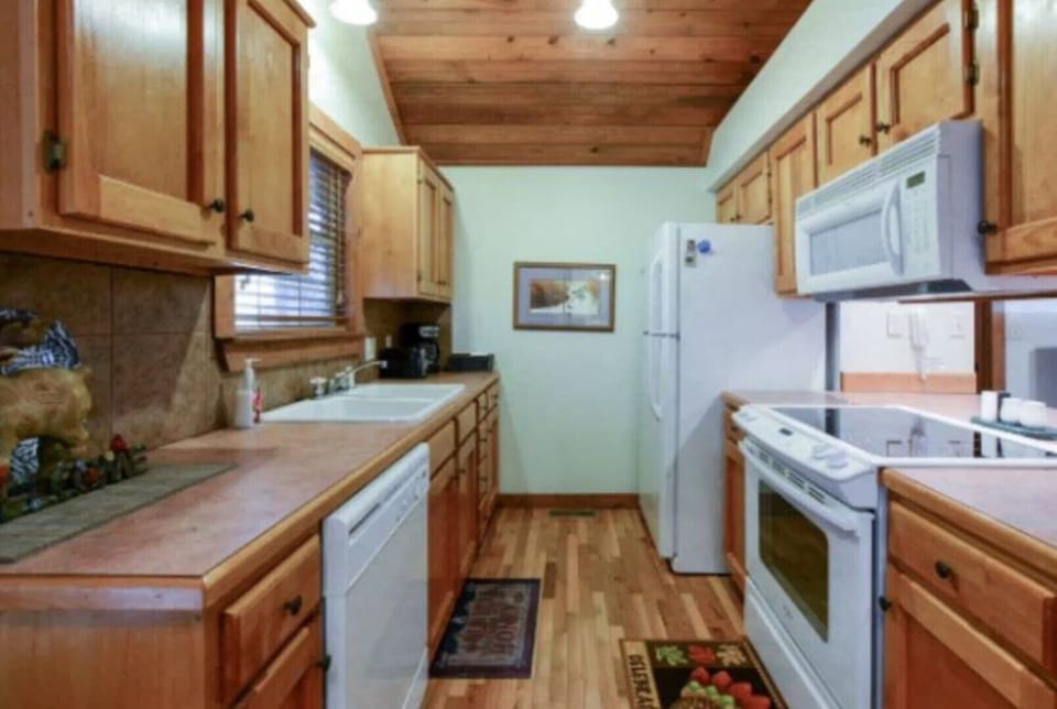 Fully stocked kitchen with dishes, silverware, coffee pot, etc.