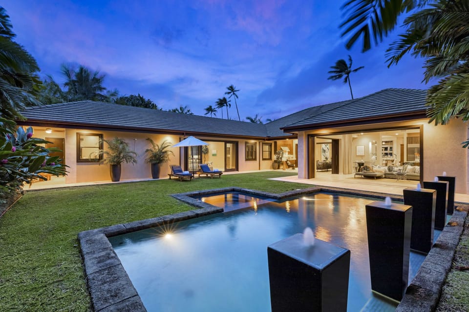 POOL FOUNTAINS - Fountains and lights create a serene landscape as night falls