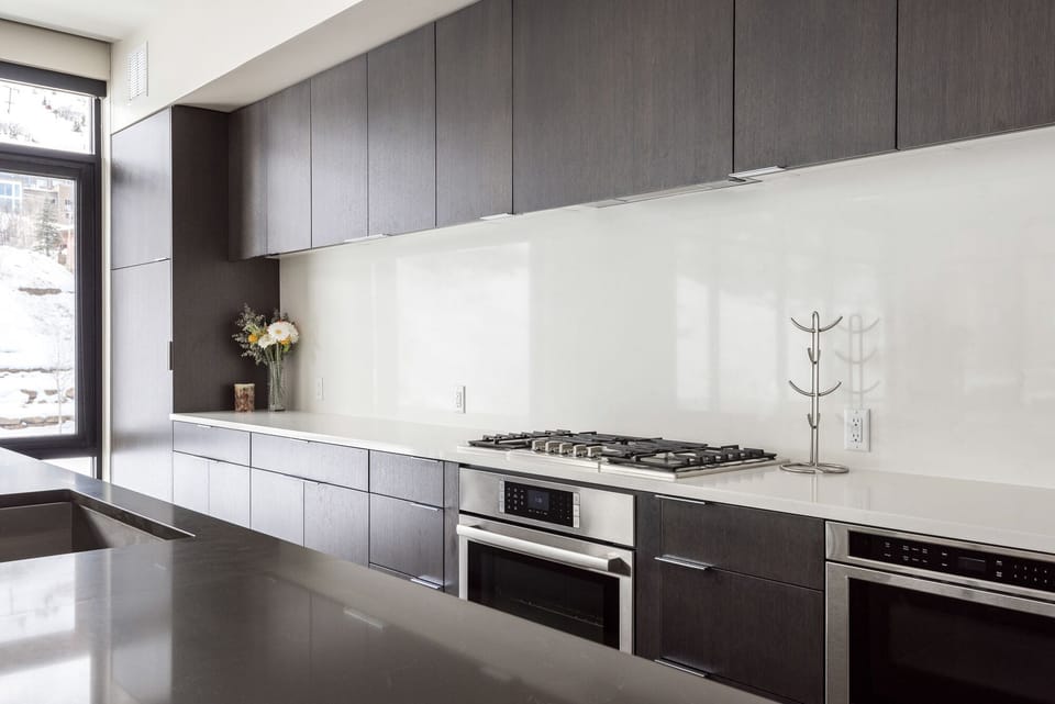 Fully equipped chef's kitchen with gas range, microwave drawer, kitchen island
