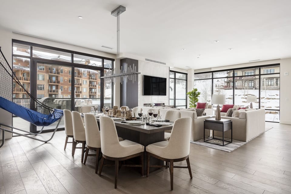 Elegant dining room with living room in the background