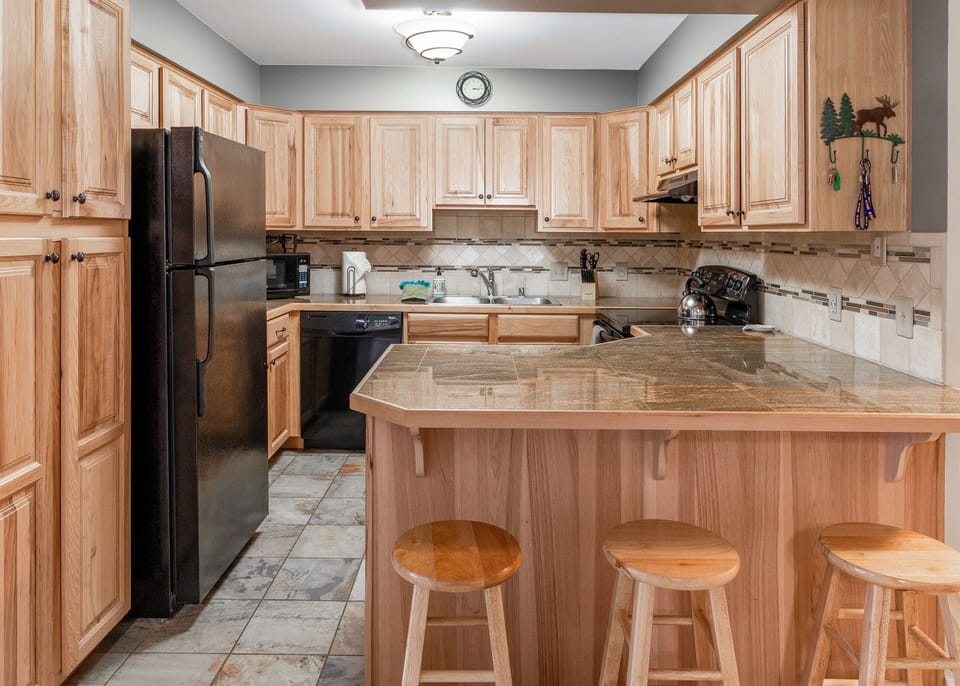 Full Kitchen and Bar with Chairs