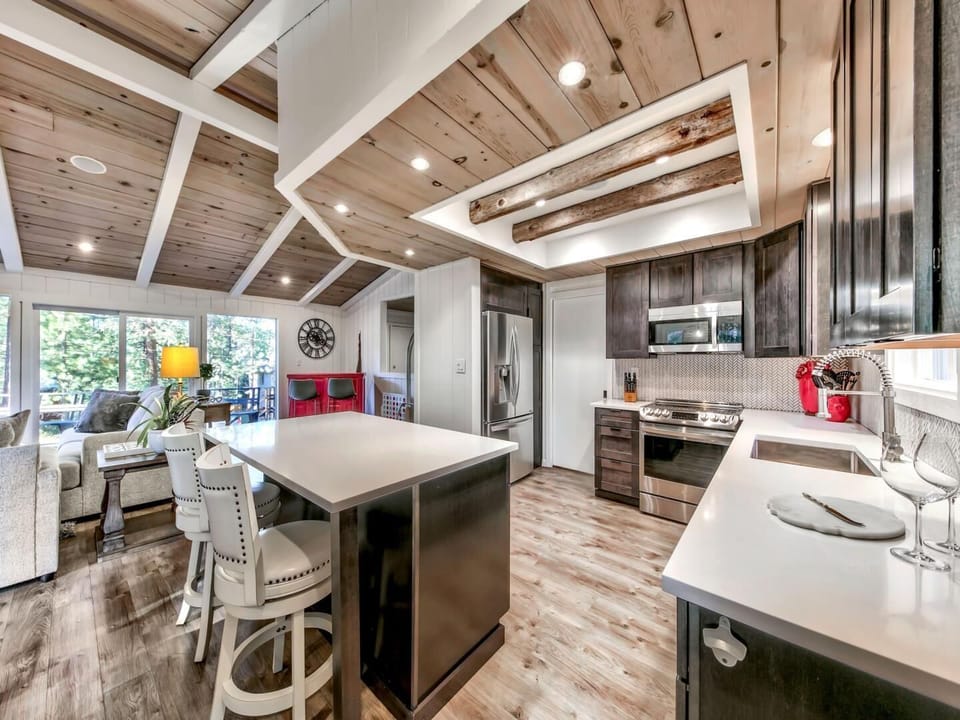 Your gourmet kitchen awaits with stunning exposed beams, granite countertops, and modern appliances for creating memorable meals together.