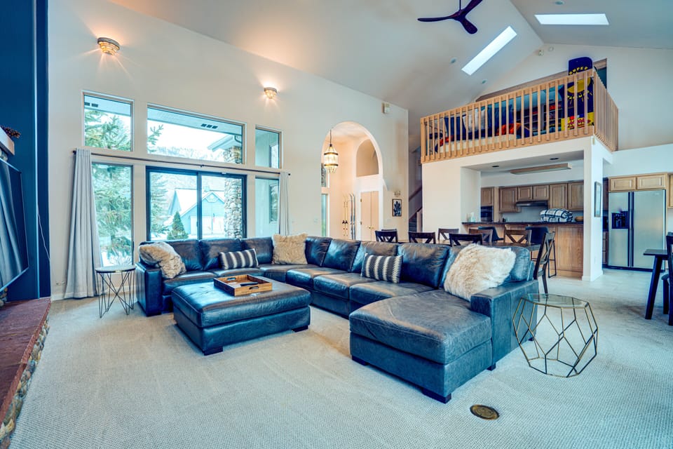 Oversized full-grain leather sofa seats 8–10 and is unbelievably comfortable.