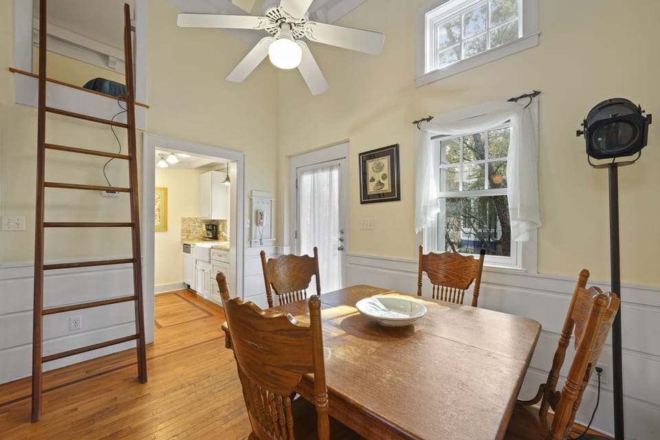 DINING SPACE WITH TABLE SEATING FOUR TO LEFT OF ENTRY