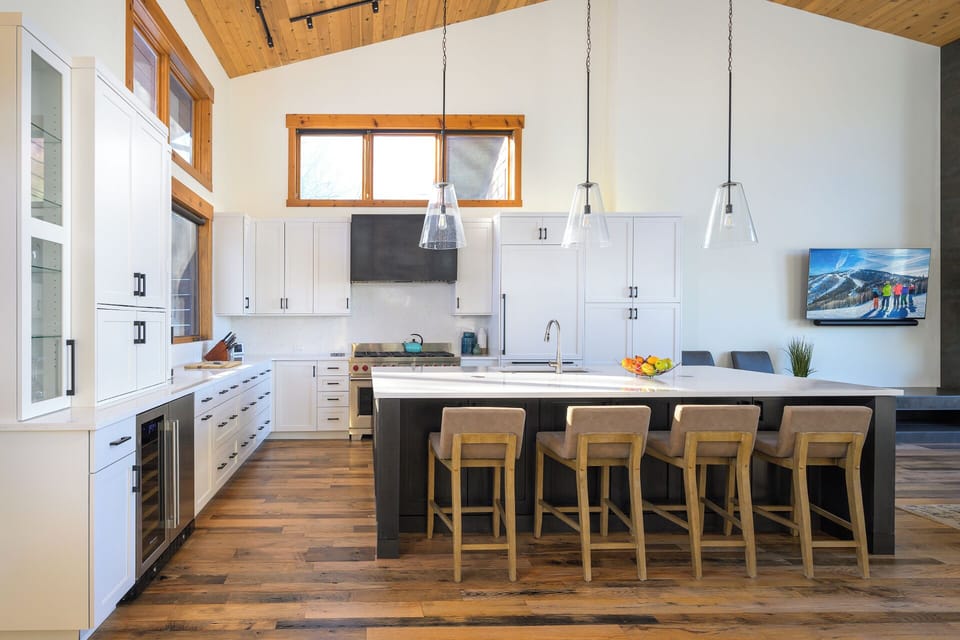 The gourmet kitchen features upgraded appliances and tons of counter space
