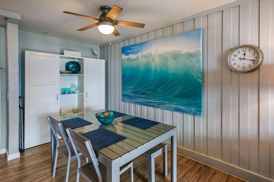 beach theme is carried through condo with accents of aqua blue