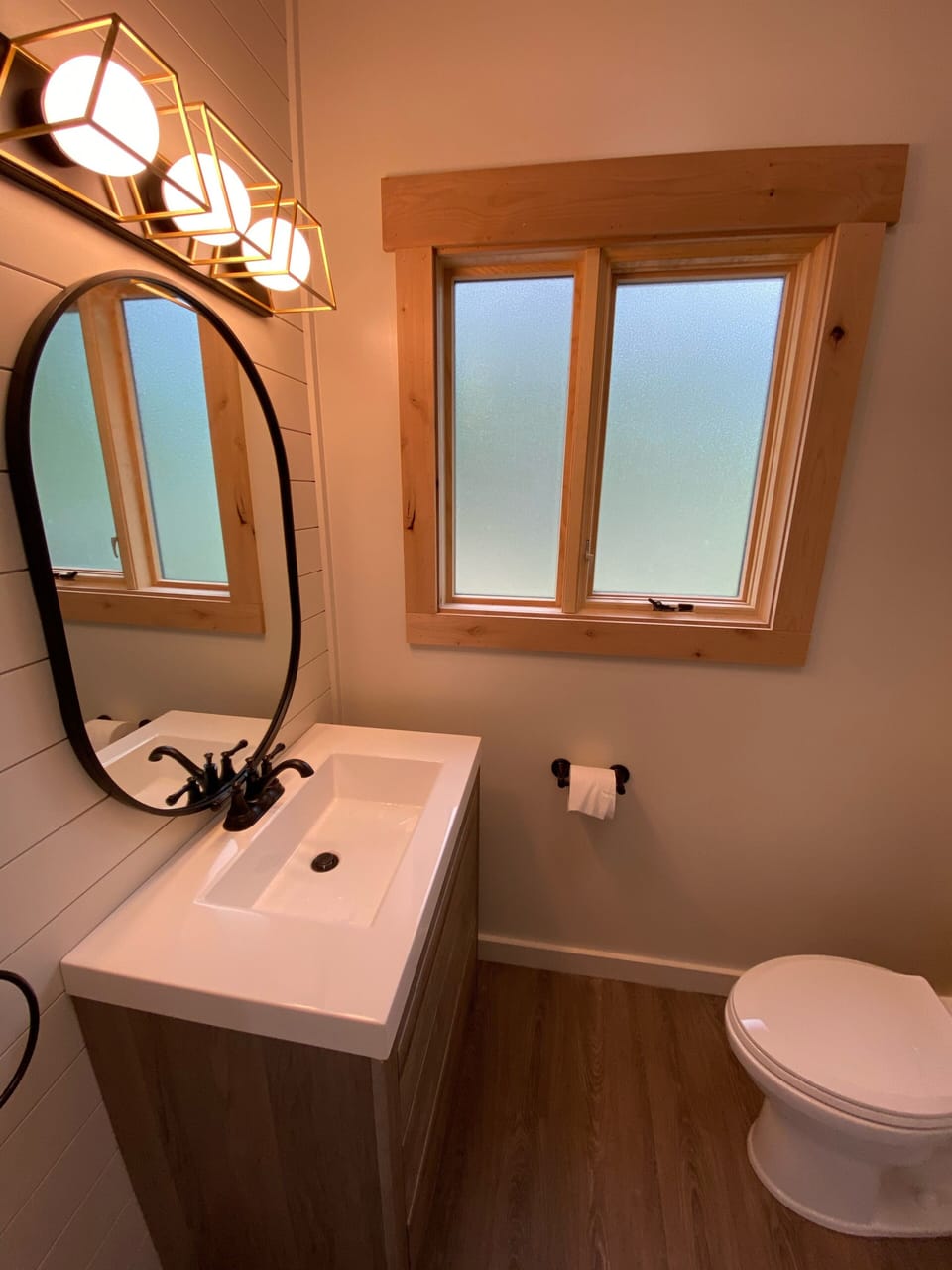 Bathroom has a nice vanity as well as a Bluetooth speaker/fan.