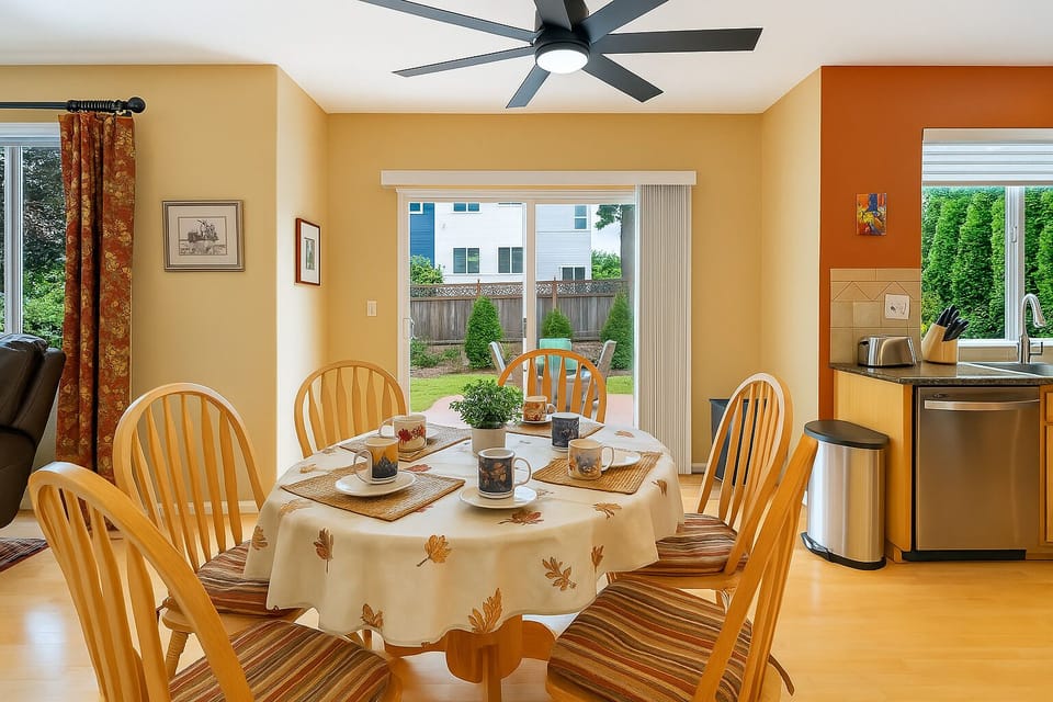 Cozy dining for six with yard access—perfect for meals, coffee & connection.