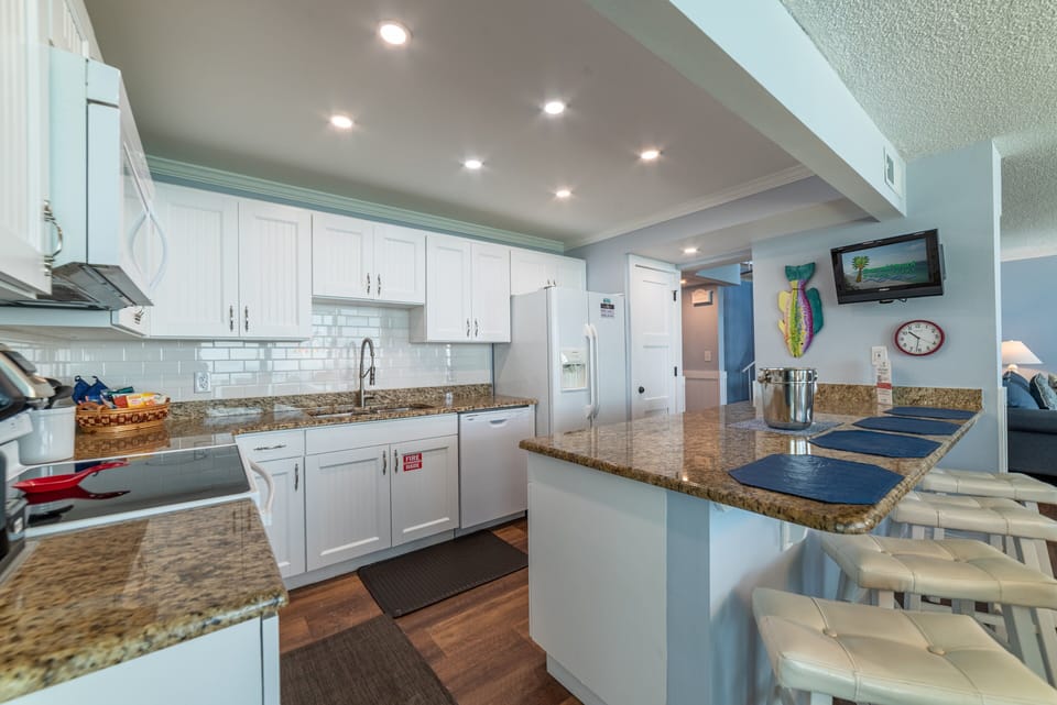 High end cabinetry and granite counter tops and a beach view, too.