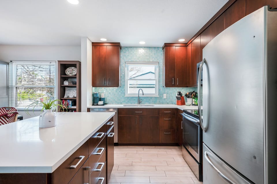 Updated kitchen with quartz counters and stainless appliances