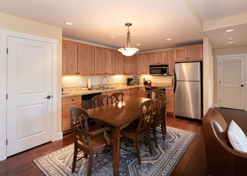 Stainless steel appliances, granite countertops and large dining area