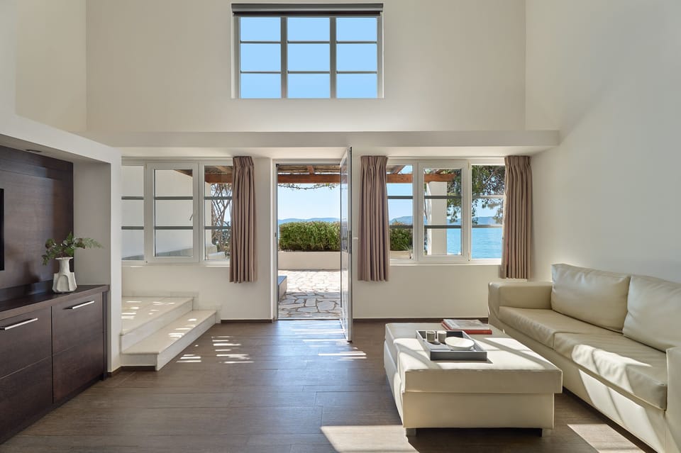 Two-Storey Beachfront Residence | Living area | 37-inch flat-screen TV with satellite channels, TV