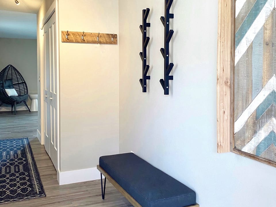 Large entry with lots of hooks and ski rest for your ski and snowboard gear.