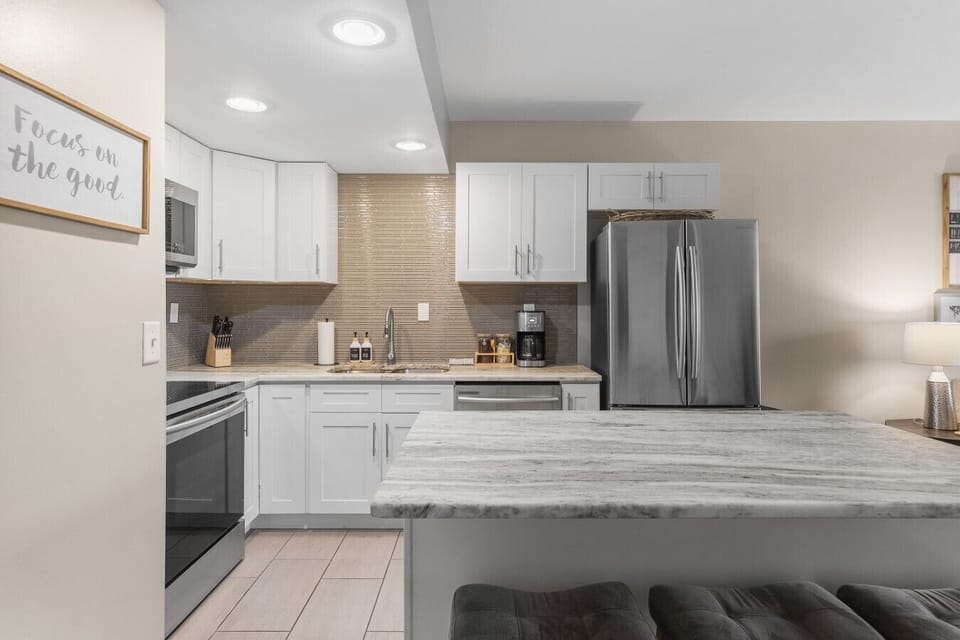 Fully equipped kitchen for all of your cooking needs! Regular drip coffee machine and coffee provided! Seating available at the island. The kitchen opens up to the living room, great for entertaining!