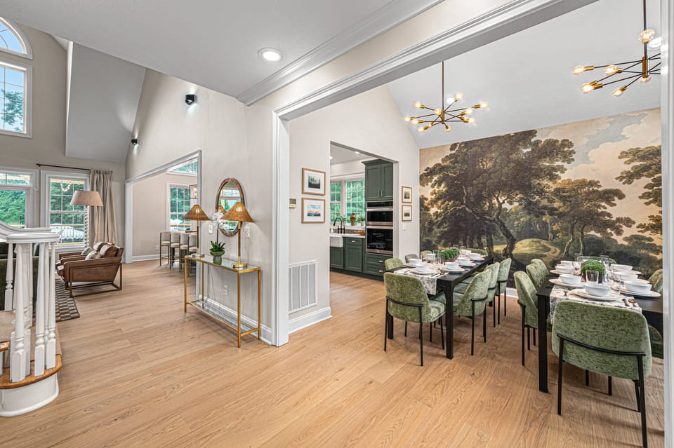 Step inside to soaring ceilings, warm hardwoods, and an immediate view of luxury living.