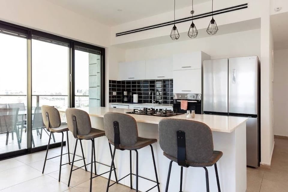 Open kitchen and dining space feels spacious, ideal for cooking and gathering during longer stays.