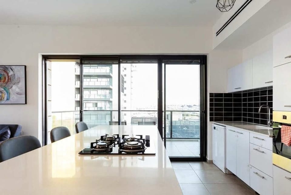 Spacious kitchen layout allows effortless cooking while staying close to shops and supermarkets nearby.