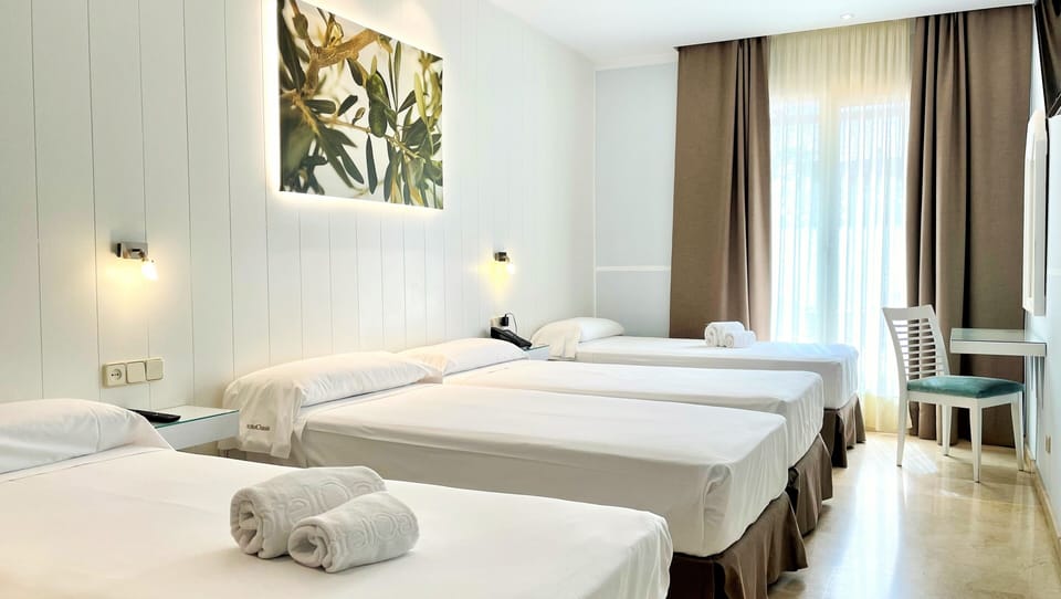 Family Quadruple Room, Multiple Beds, Non Smoking | In-room safe, desk, laptop workspace, soundproofing