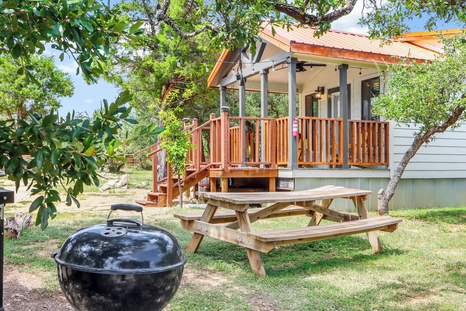Grill and picnic table outside of the tiny house