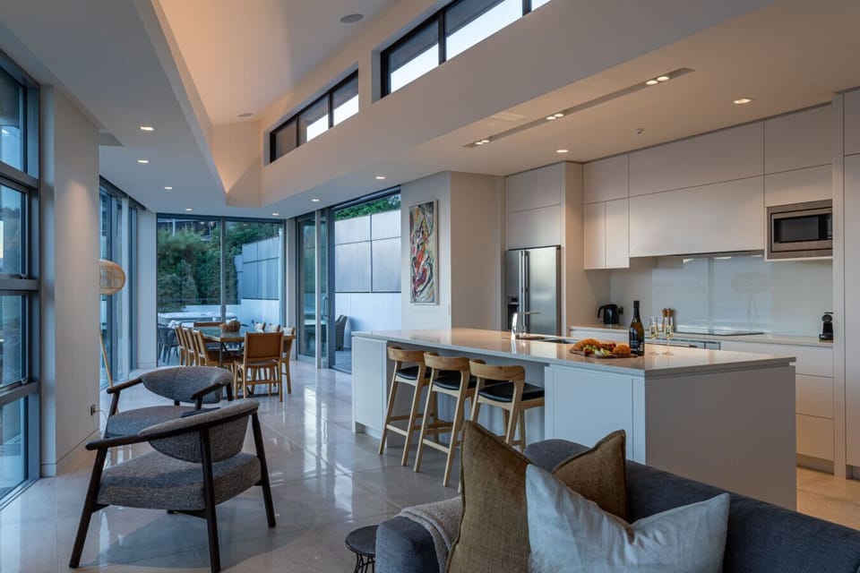 A fully-equipped kitchen including dishwasher, oven, induction cooktop, coffee machine and more.