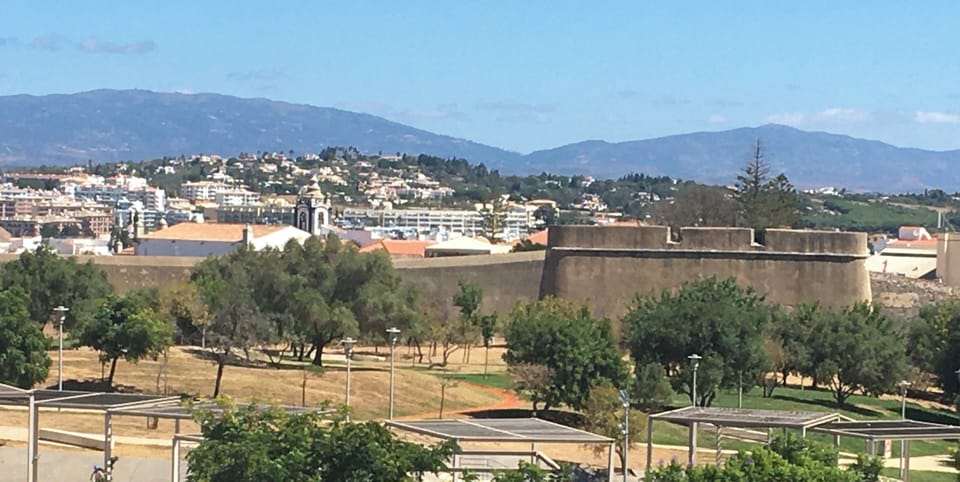 View from main terrace: park, old city wall, Old Town and Monchique mountains