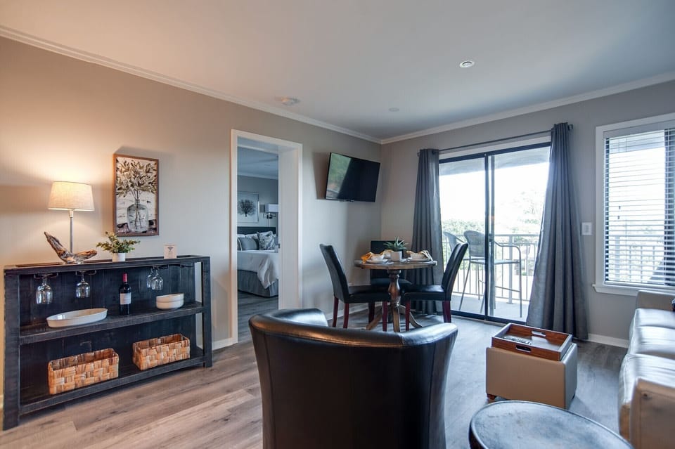 Carolina Beach Club 428 - Stylish Living Area - Combination Living and Dining area with sliding glass door to the balcony.  Beautiful side table for your wine.