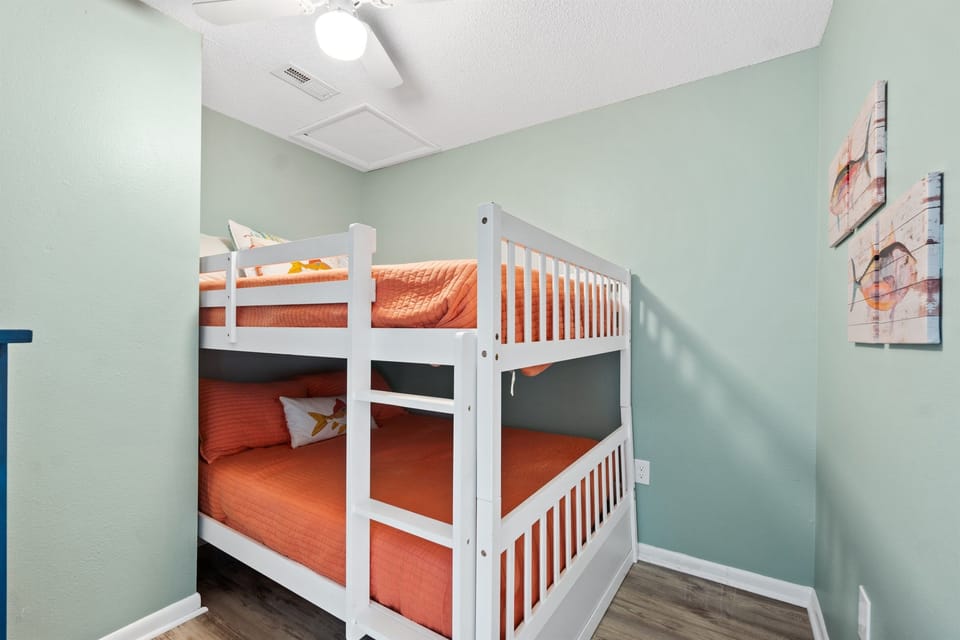 Bunk room with double beds, dresser and tv not shown in picture. 