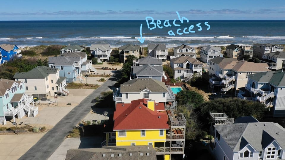 Our yellow  house is 4 houses over frm the private beach access point.