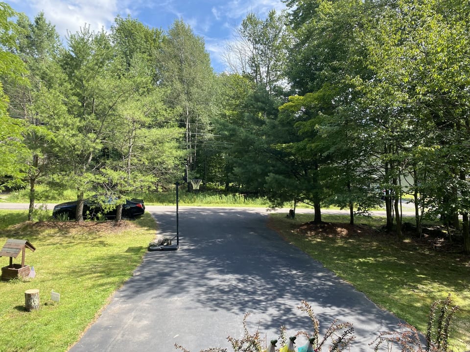 Large Driveway with a Basketball Rim 