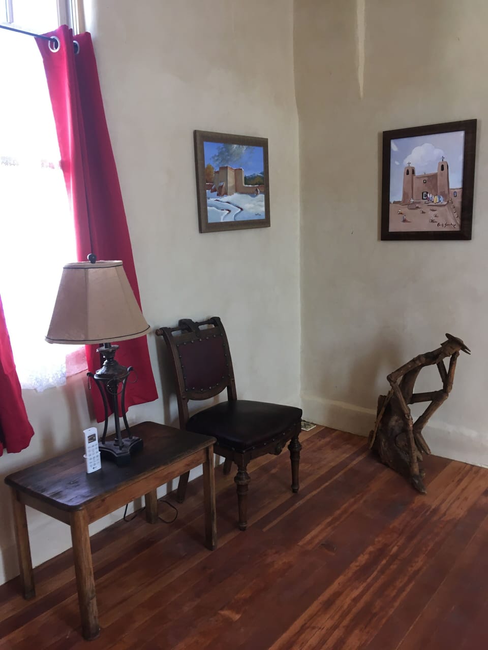 Living room features a collection of paintings by local artist Paul Sanchez. 