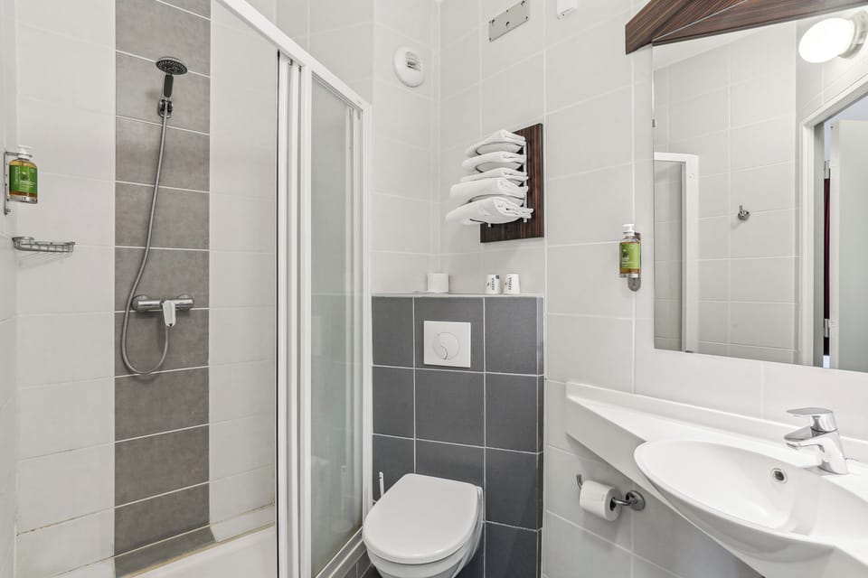 Shower, free toiletries, hair dryer, towels