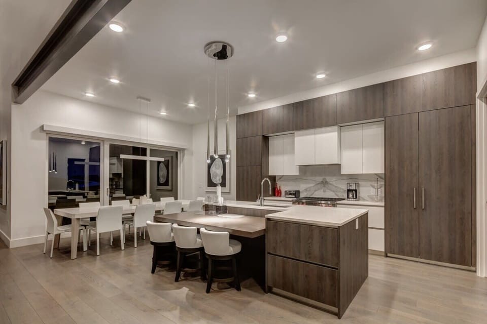 Gourmet Kitchen with Wolf and Sub-Zero appliances, breakfast bar with seating for 3