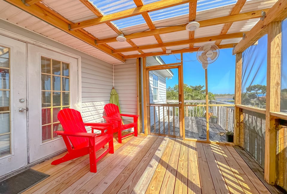 Relax in the privacy of your master screen porch.  French doors enter into suite