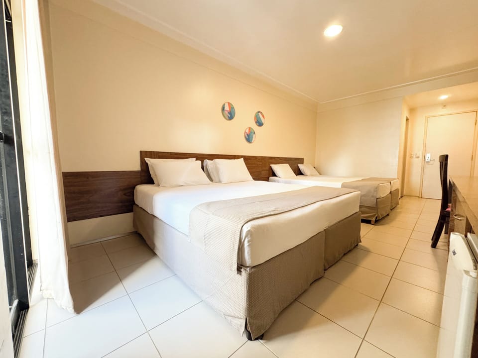 Standard Quadruple Room, Multiple Beds | In-room safe, desk, laptop workspace, blackout drapes
