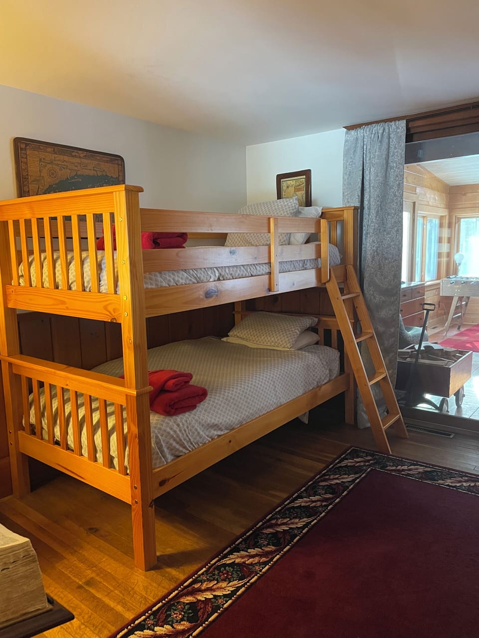 A third “alcove” room has twin bunk beds.
