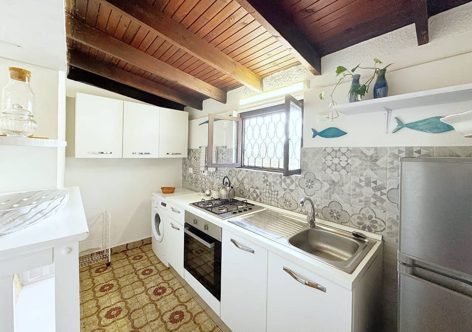 Villa | Private kitchen | Full-size fridge, oven, stovetop, cookware/dishes/utensils