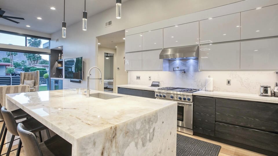 Waterfall island, pro appliances & open layout for cooking & connection.
