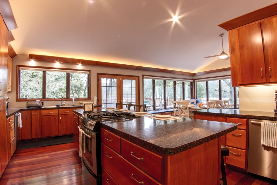 French doors from kitchen go to backyard wrap-around deck
