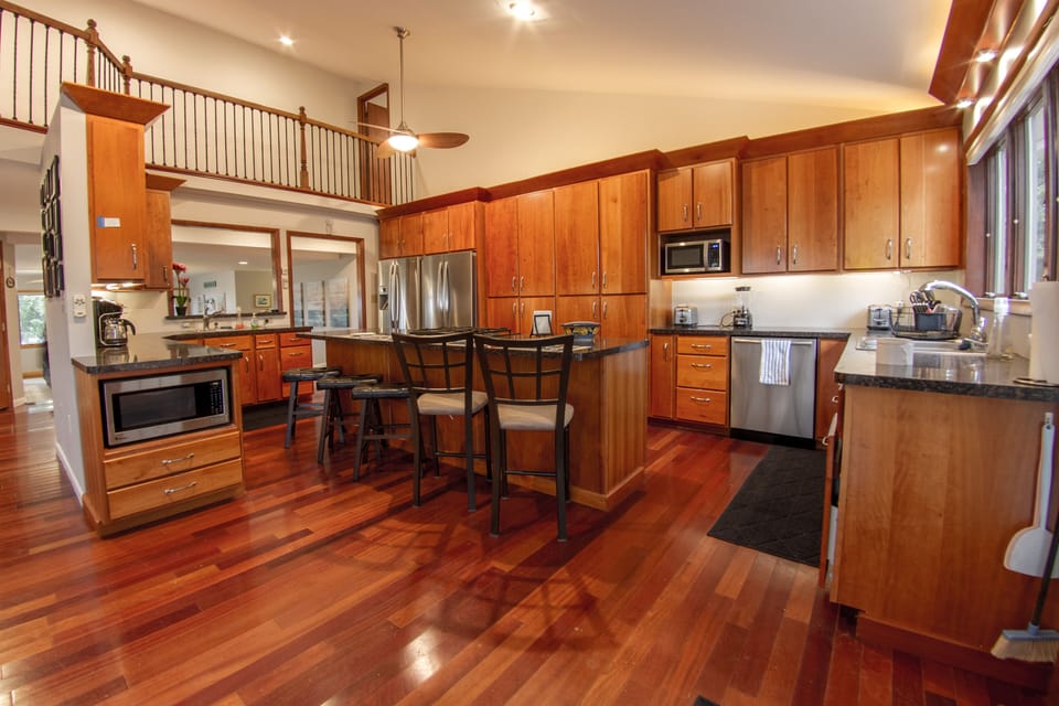 Kitchen island seats 4.  Kitchen has 2 refrid, dishwashers, sinks, microwaves