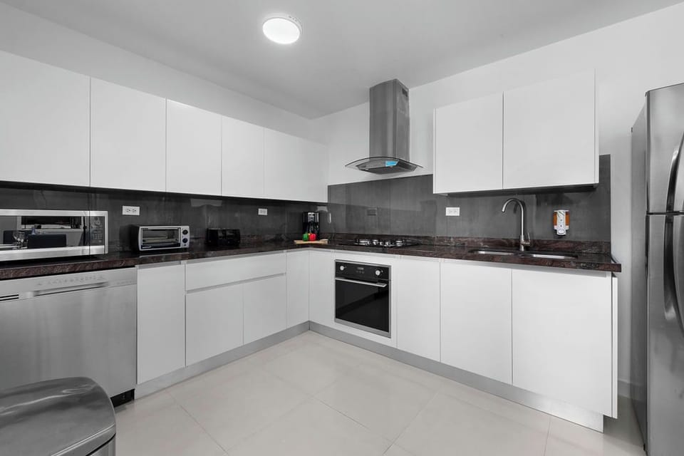 Designed for both convenience and style, this modern kitchen features high-quality appliances, cookware, and plenty of counter space. Whether you prefer a quick snack or a full-course meal, this space has you covered!
