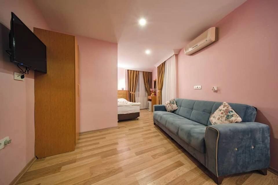 Family Room, Balcony | Minibar, in-room safe, iron/ironing board, free WiFi