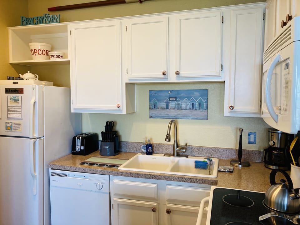 Equipped-to-the-hilt galley kitchen plus hospitality coffee, tea & more