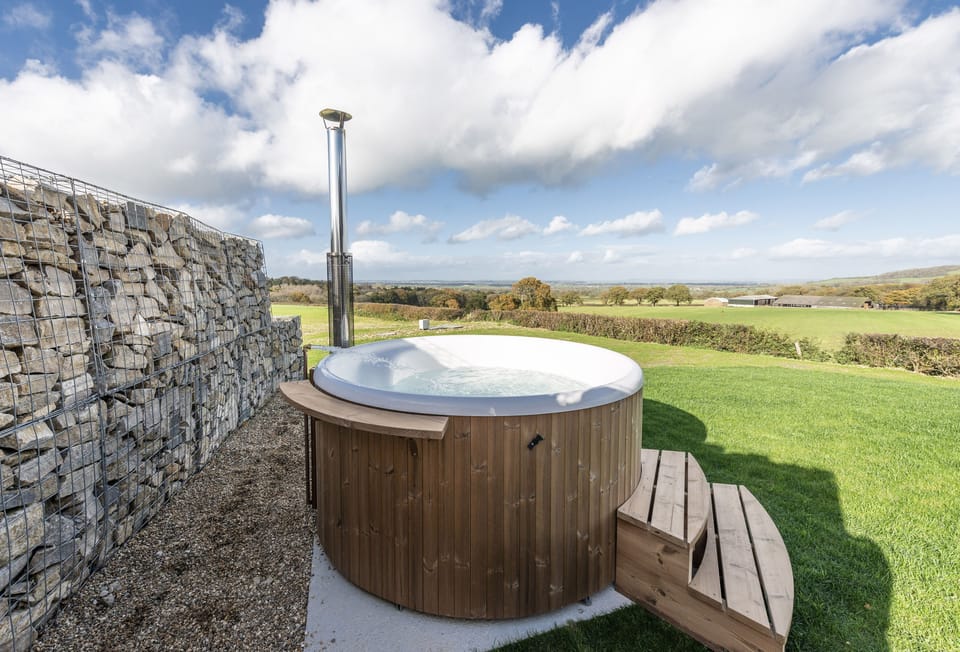 Fern, Ansty: The Skarsgard hot tub and rural views beyond