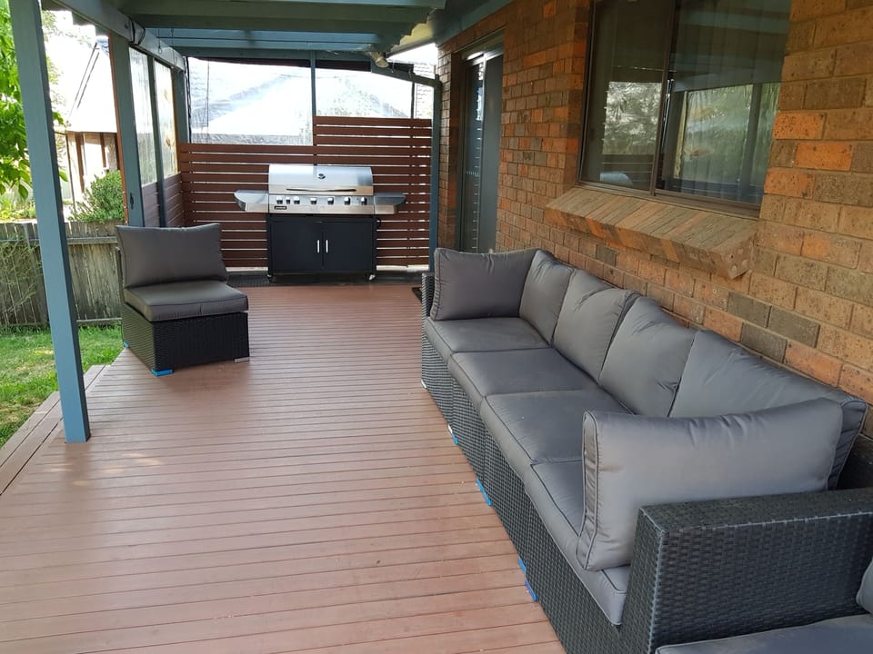 Relax on the deck overlooking the backyard, with BBQ