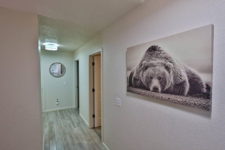 hallway on top floor leading to all 3 bedrooms and 2 full baths