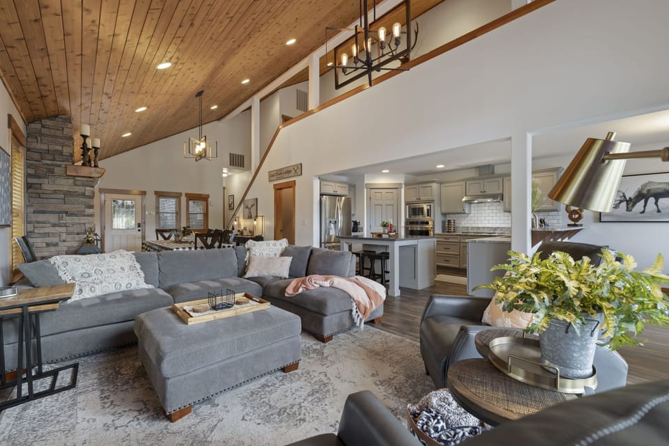 Living Area With Plush Sofas And Grand Timber Beams
