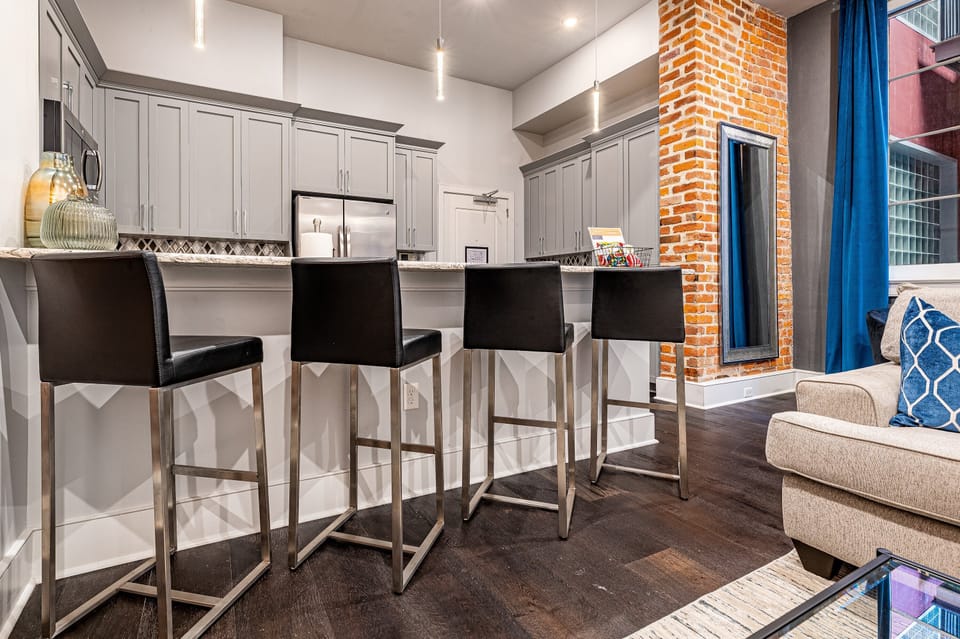 Open concept living, kitchen, and dining area with plenty of seating for you and your guests. 55” Samsung Smart 4K TV with streaming options and DIRECTV Entertainment. Dining table for two, and a sofa that converts to a full-size sleeper!