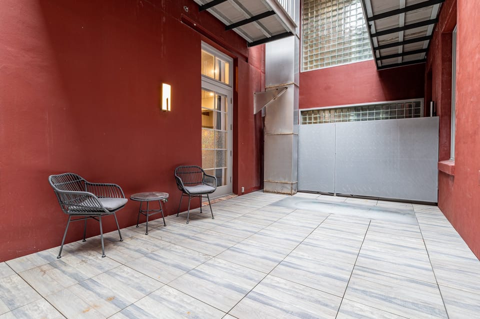 Outdoor patio with seating for two. Perfect for morning and evening relaxing!