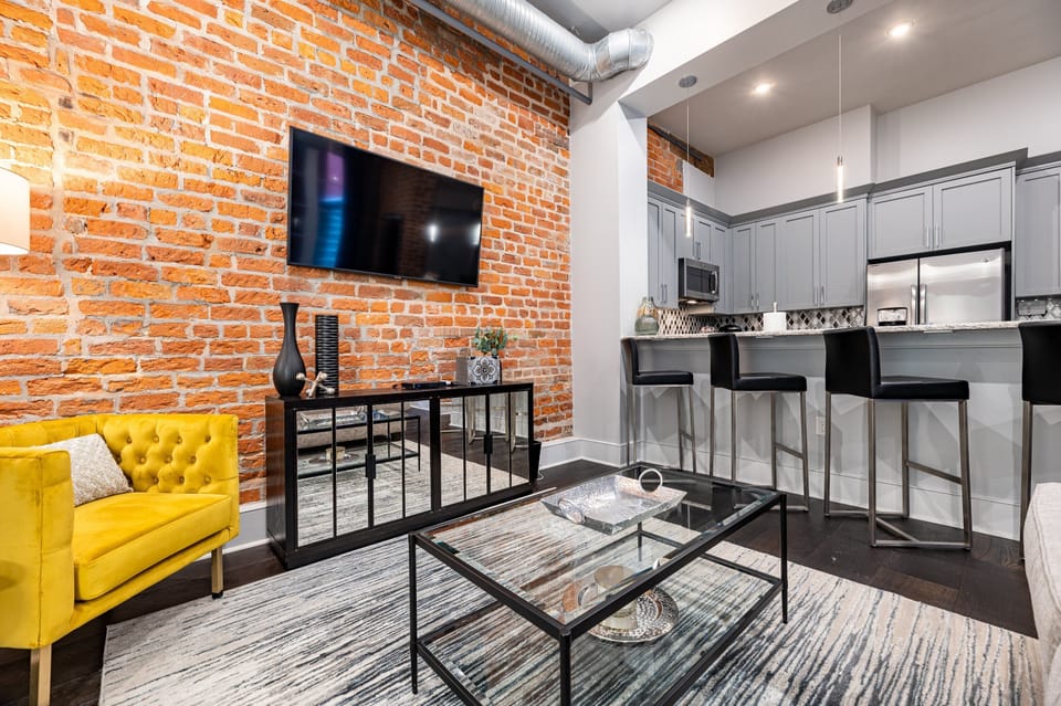 Open concept living, kitchen, and dining area with plenty of seating for you and your guests. 55” Samsung Smart 4K TV with streaming options and DIRECTV Entertainment. Dining table for two, and a sofa that converts to a full-size sleeper!